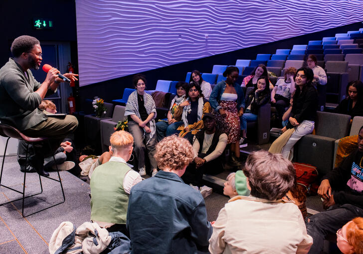A group of people in a poetry workshop/talk