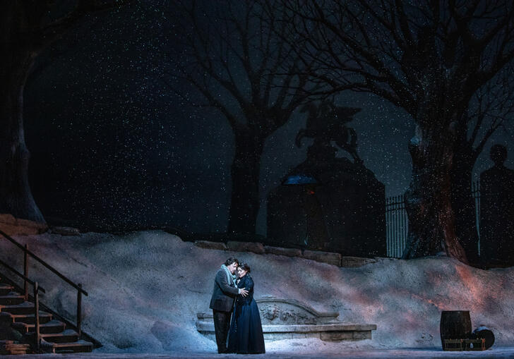 A dark stage appears, covered in fog.