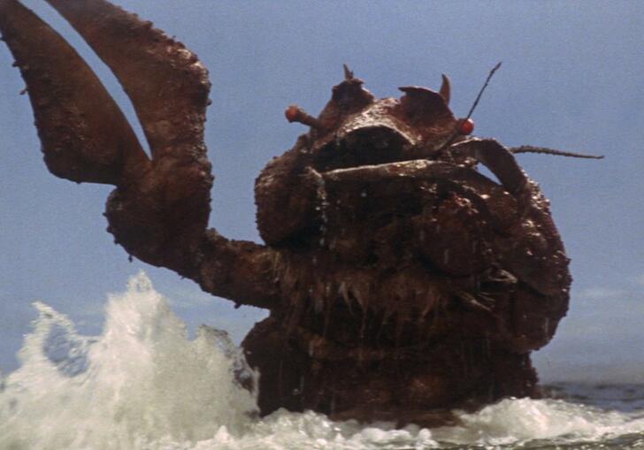 A film still showing Ebirah, the giant crustacean monster, emerging from the sea with his claw raised