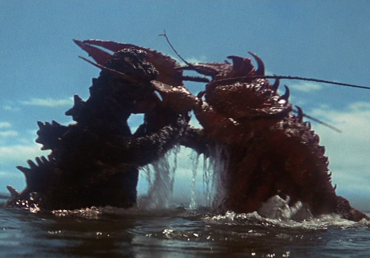 Two monsters, Godzilla and Ebirah, locked in combat in the sea