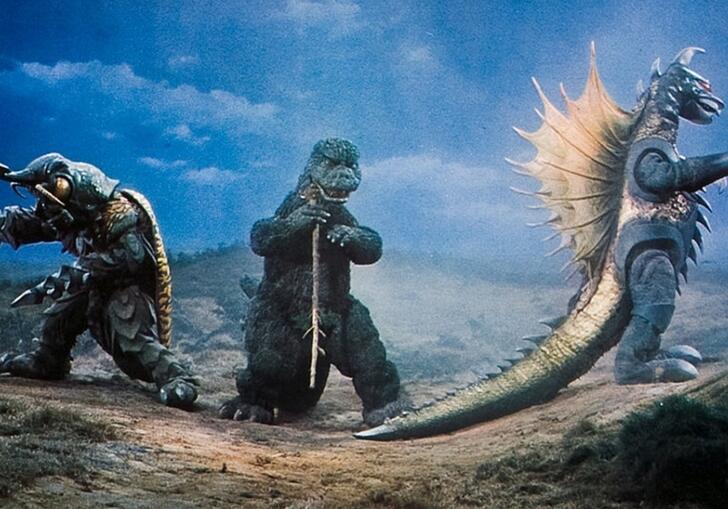 Godzilla, Megalon and Gigan standing in a row