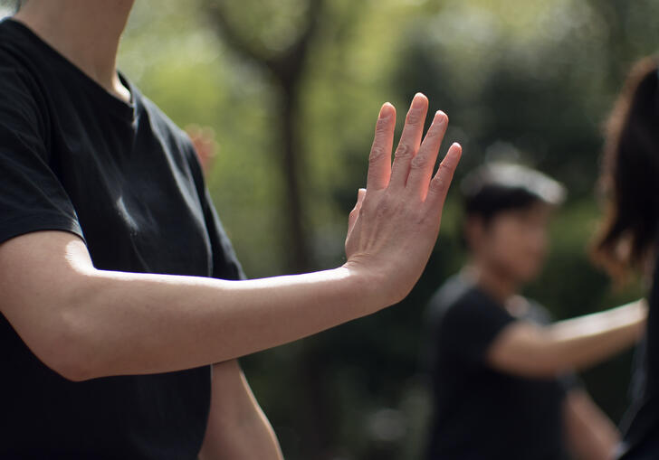 A close up of a person practicing Tai Chi