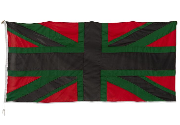 A Union Jack flag using the colours red, green and black.