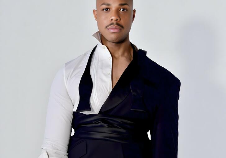 Davone Tines in an avant garde suit