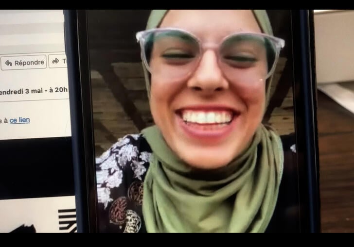 A young woman on a video call.