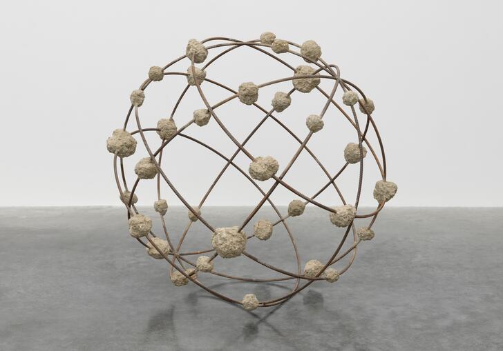 Mona Hatoum's sculpture Orbital - a spherical structure, resembling a globe, made from steel reinforcement bars and clumps of rough concrete