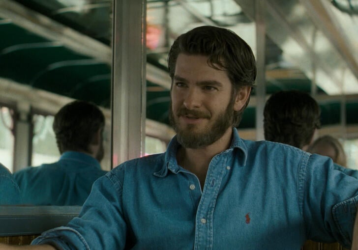 A man sitting on a bus