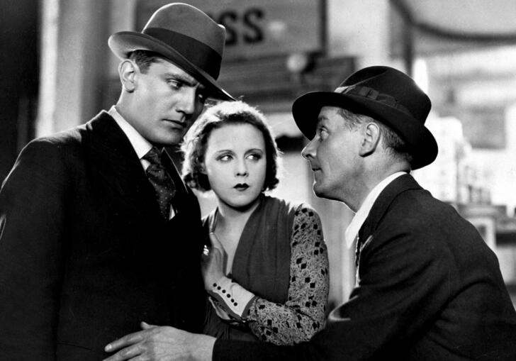 two men and a woman talking