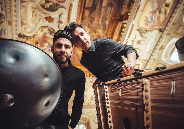 Manu Delago and Maz ZT looking down at the camera