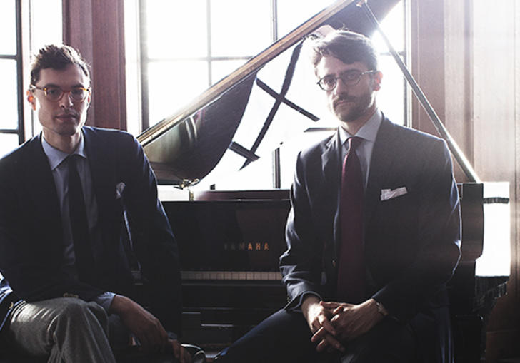 A colour photograph of Timo Andres and David Kaplan by a piano