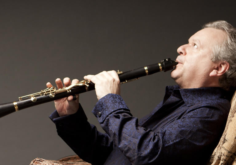 Photo of Collins playing oboe