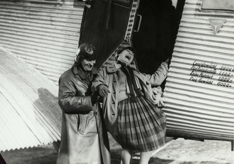 A. Rodchenko and V. Stepanova descending from an airplane.