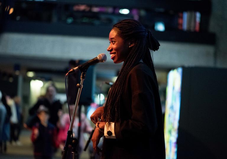 photo of a young poet on stage