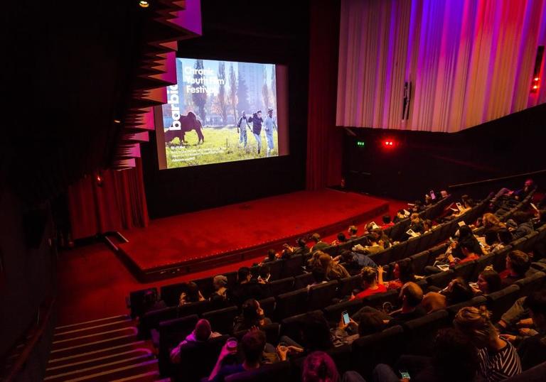 Photo of audience watching a film in the Barbican Cinema