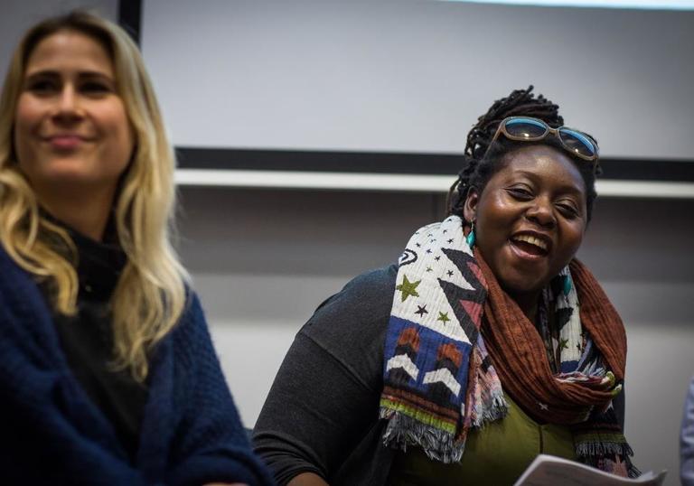 Photo of two people laughing