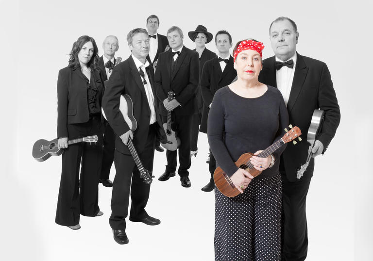 Kitty Lux at the front of the Ukulele Orchestra of Great Britain