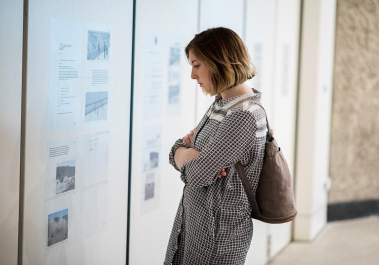 girl looks at wall