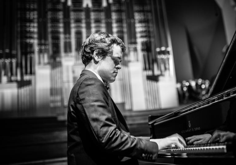 Benjamin Grosvenor playing piano black and white