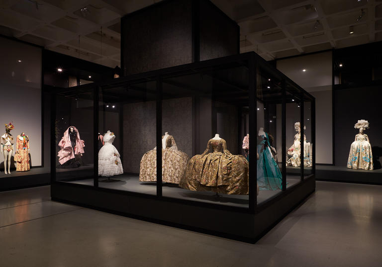 Photo of selection of dresses in a glass exhibition case