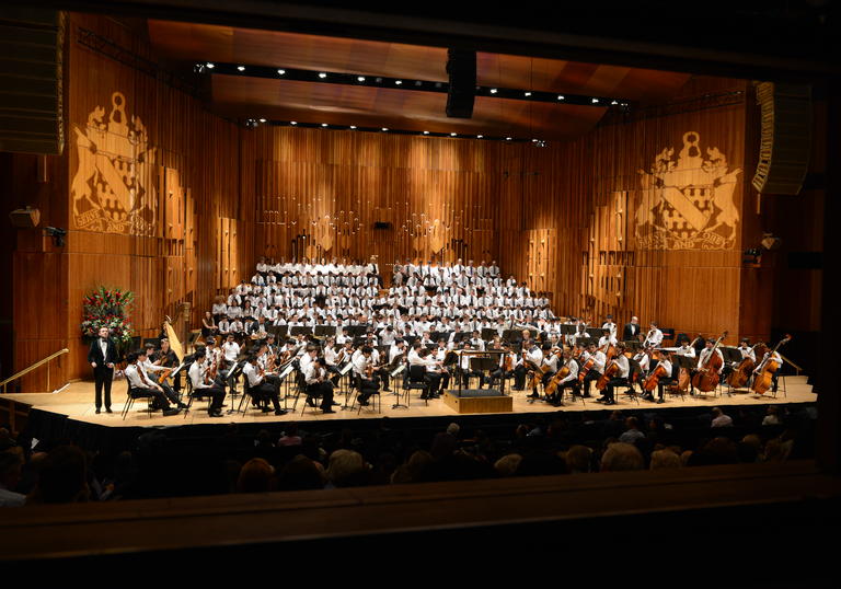 Haberdashers' Boys' School choir and orchestra on stage