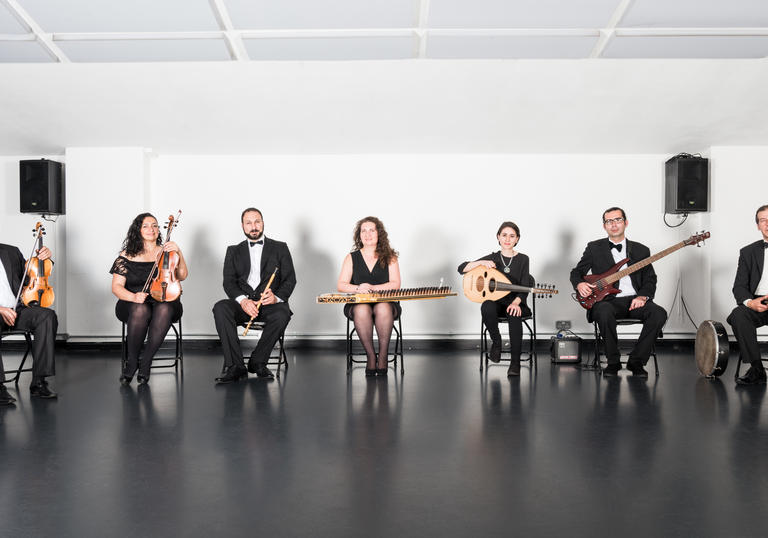 The London Syrian Ensemble sitting in a row