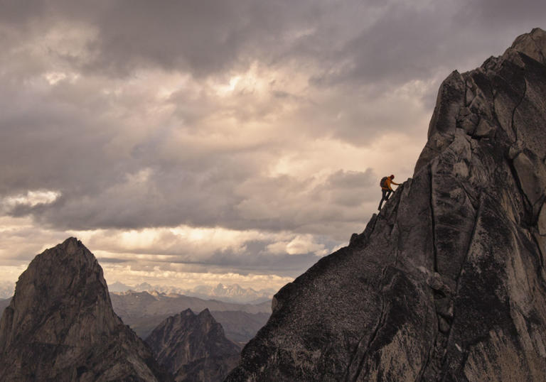 A man climbing a mountain