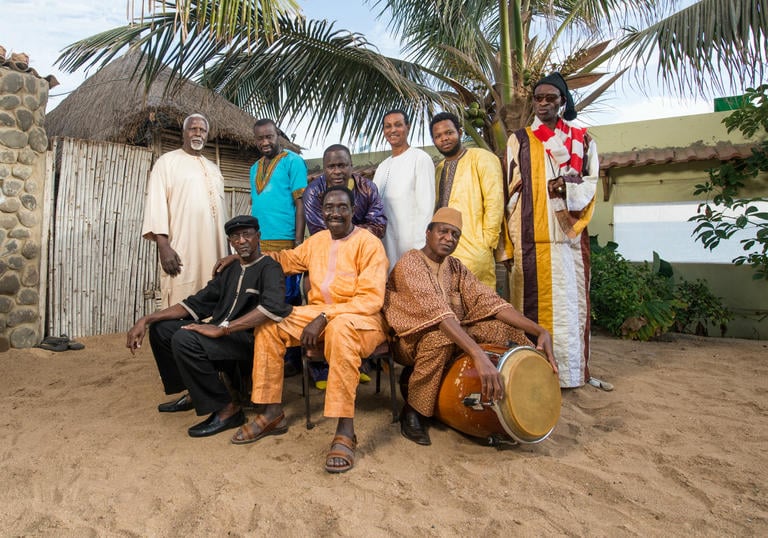Orchestra Baobab posing with their instruments