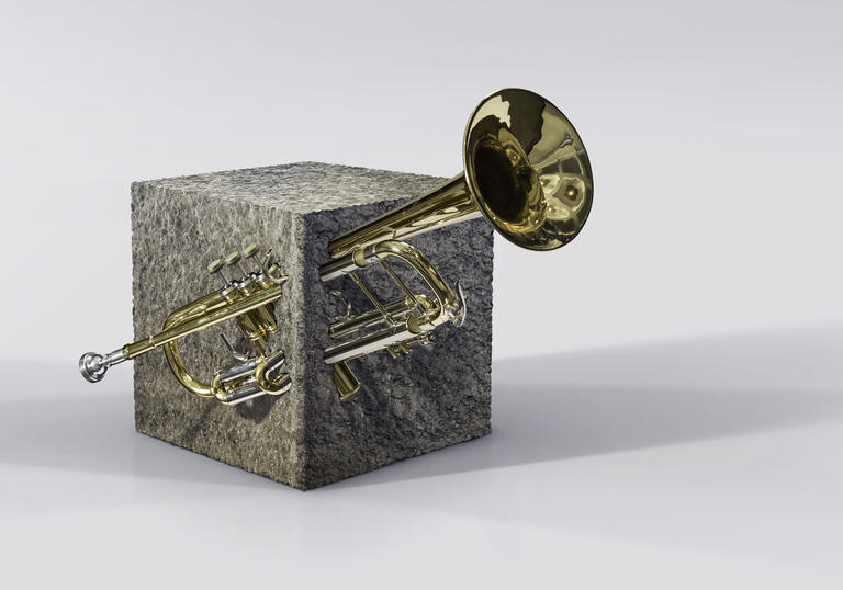 A trumpet embedded in Barbican concrete