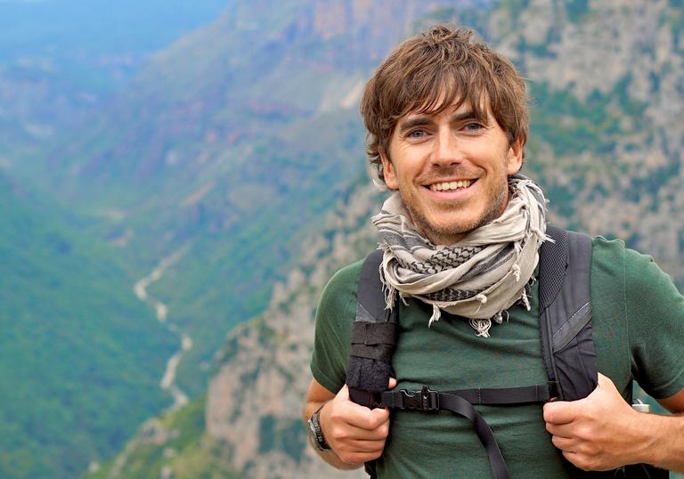 Simon Reeve on a mountain