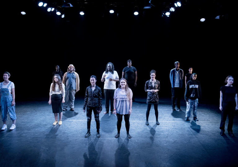 Group of young people standing on a stage