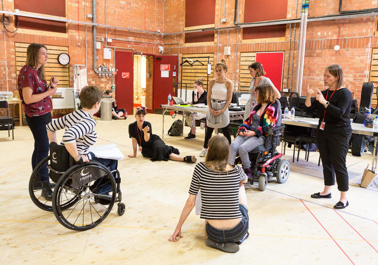 A group of people sat in a circle