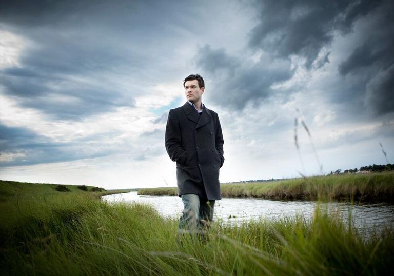 Ryan Wigglesworth standing in a field