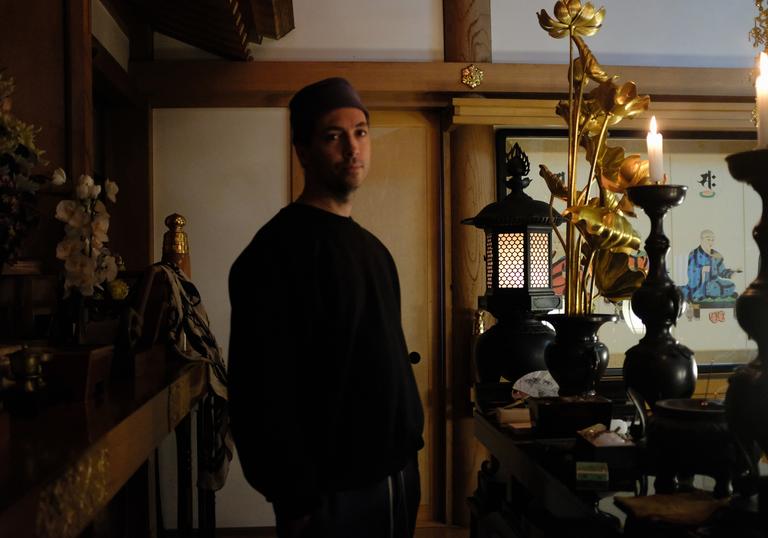Tim Hecker standing in a temple