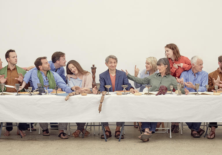 Robert Hollingworth and I Fagiolini sitting at a table