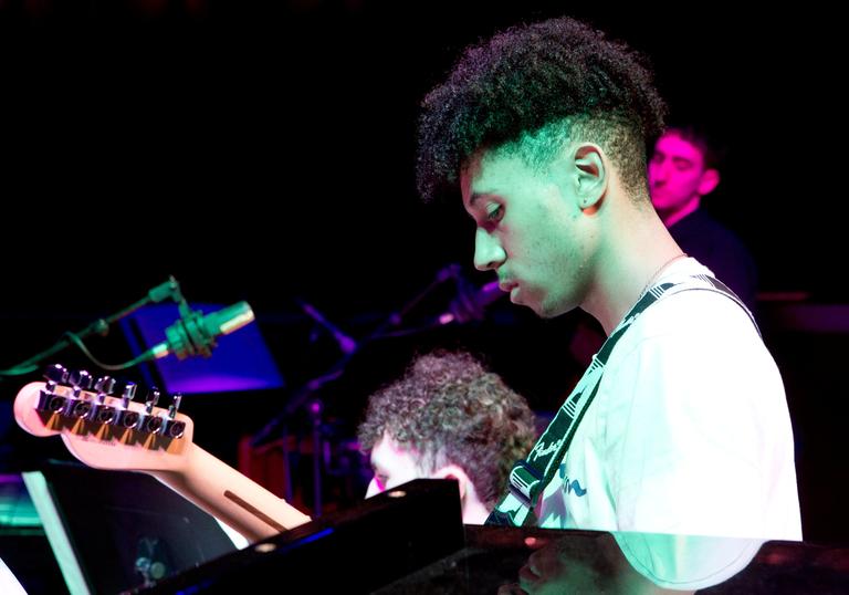 young guitar player performing