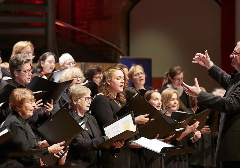 The LSO Community Choir performing with choral director
