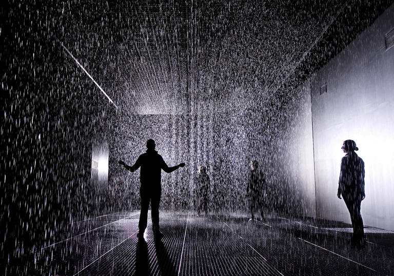 Figure standing in the rain