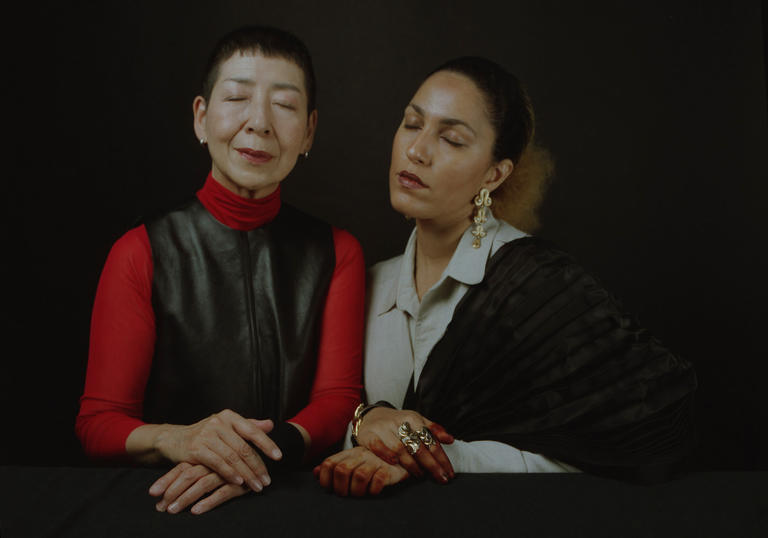 Midori Takada and Lafawndah sit side by side with their eyes closed