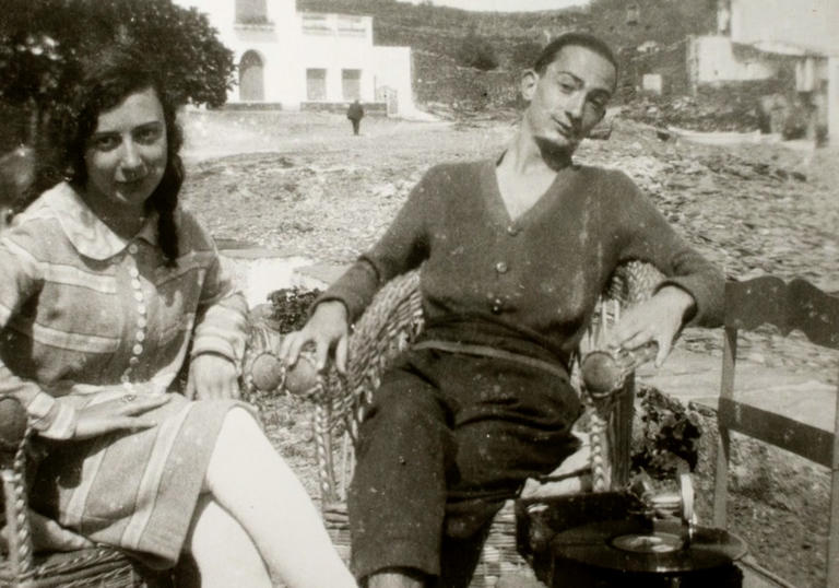 A black and white photo of Salvador Dalí and his muse, Gaya