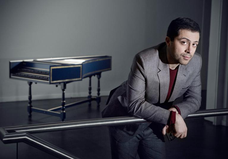 Mahan Esfahani leaning near hapsichord