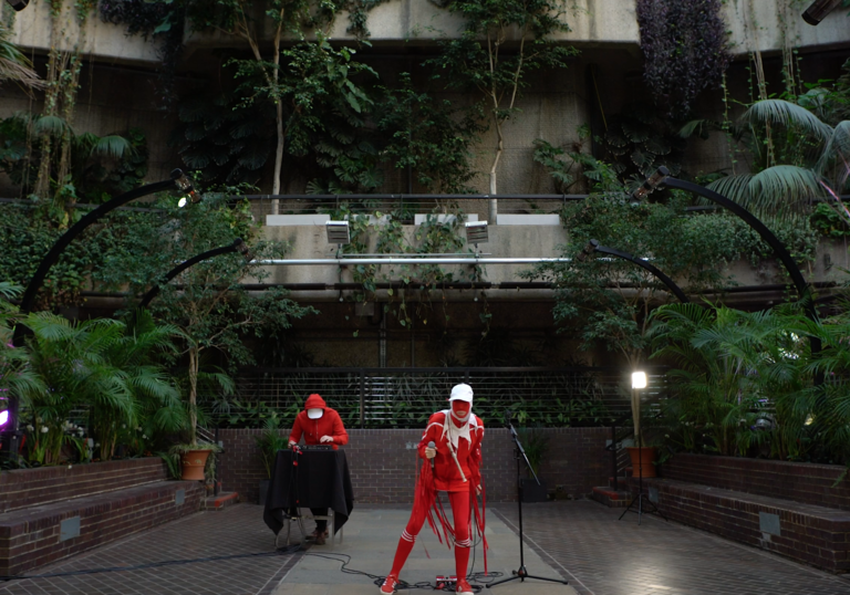 Two figures in costume in the Conservatory