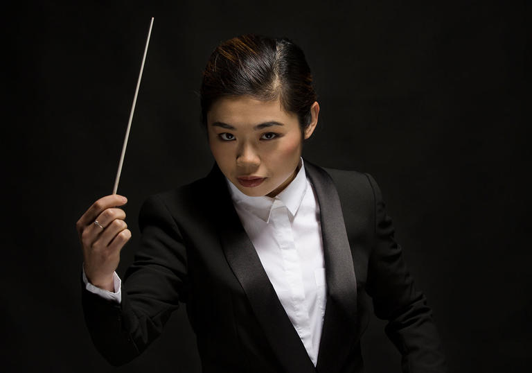 Elim Chan conducts