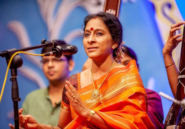 Bombay Jayashri clapping as she performs