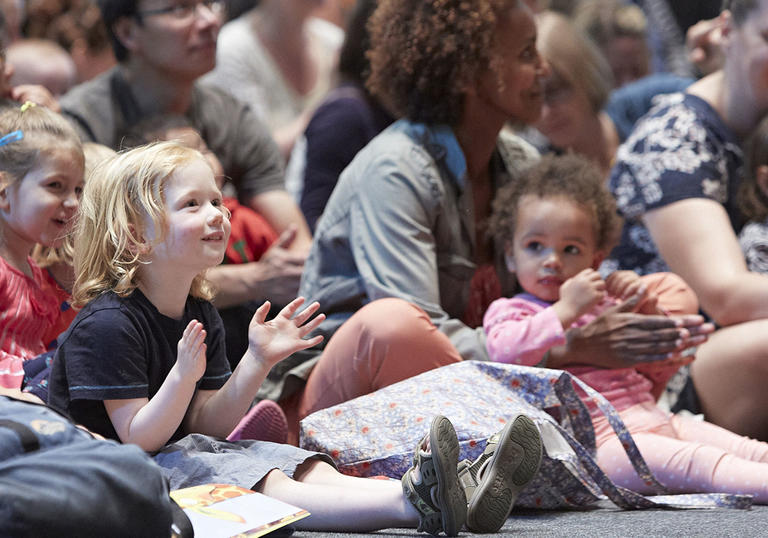 Young children watch a storytelling concert