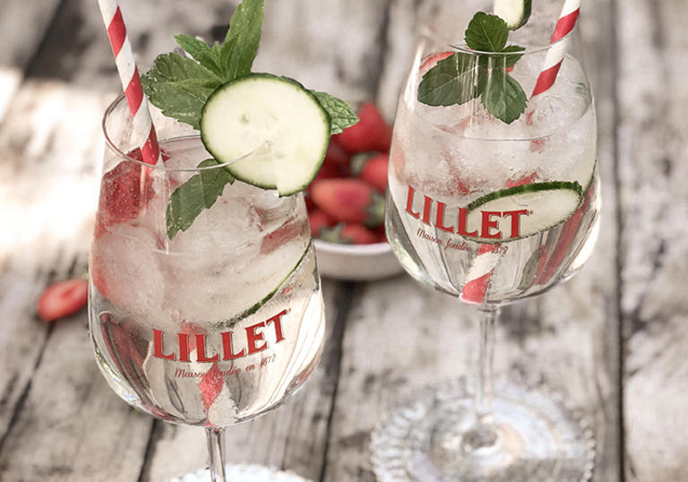 Photo of two Lillet cocktails set on wooden table