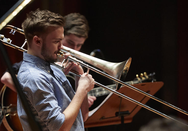 Guildhall Jazz Orchestra musician playing the trombone