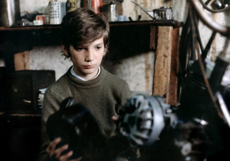 Photo of young man holding weights