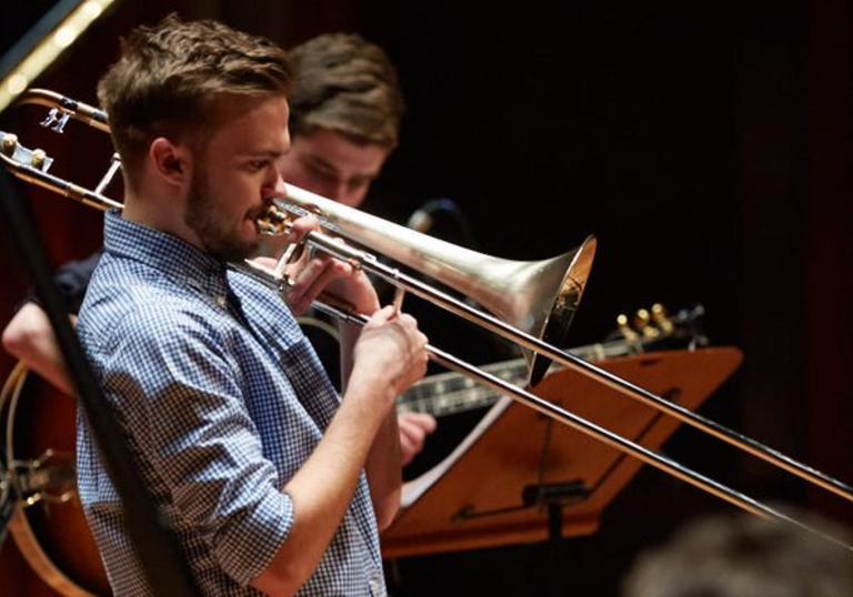 Guildhall Jazz Orchestra musician playing the trombone