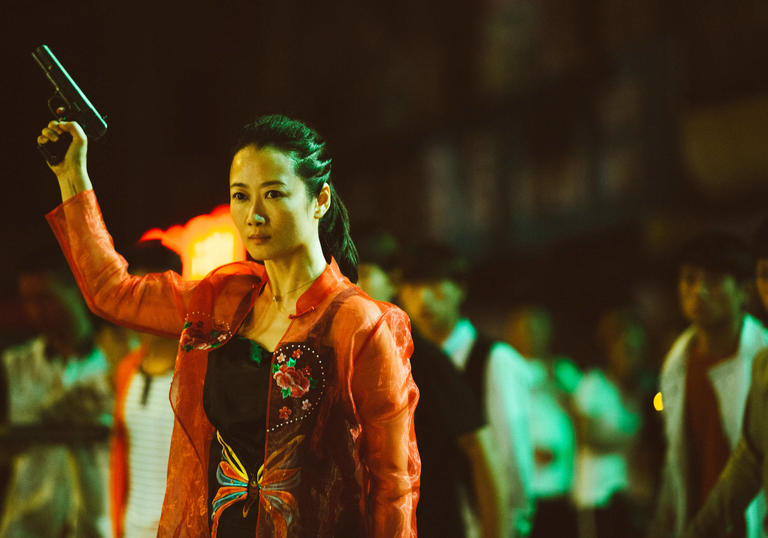 Tao Zhao wielding a handgun