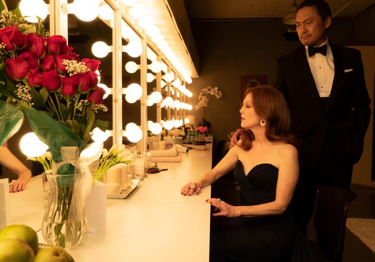Ken Watanbe and Julianne Moore stood in front of a dressing room mirror.